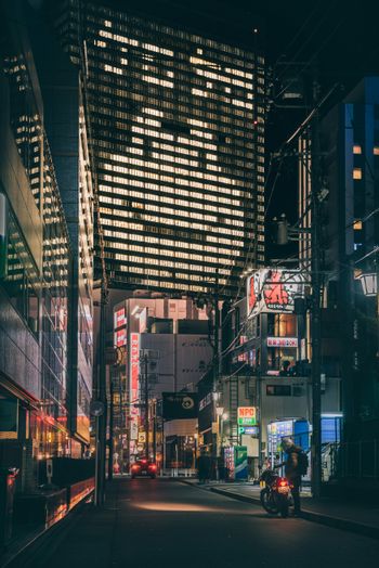 a city street filled with lots of tall buildings