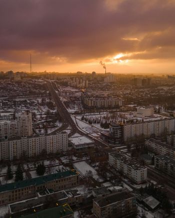 a city with lots of buildings and a cloudy sky