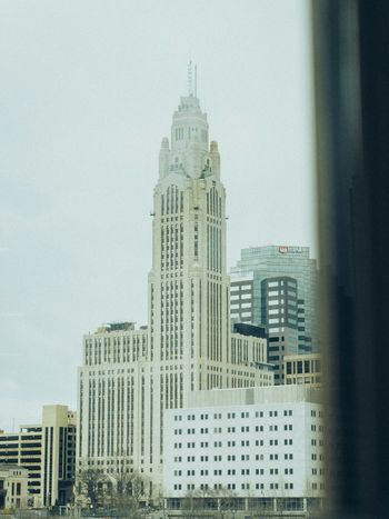 a view of a city from a train window