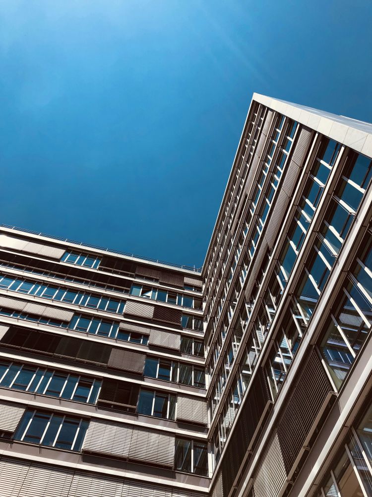 tall brown concrete building during daytime