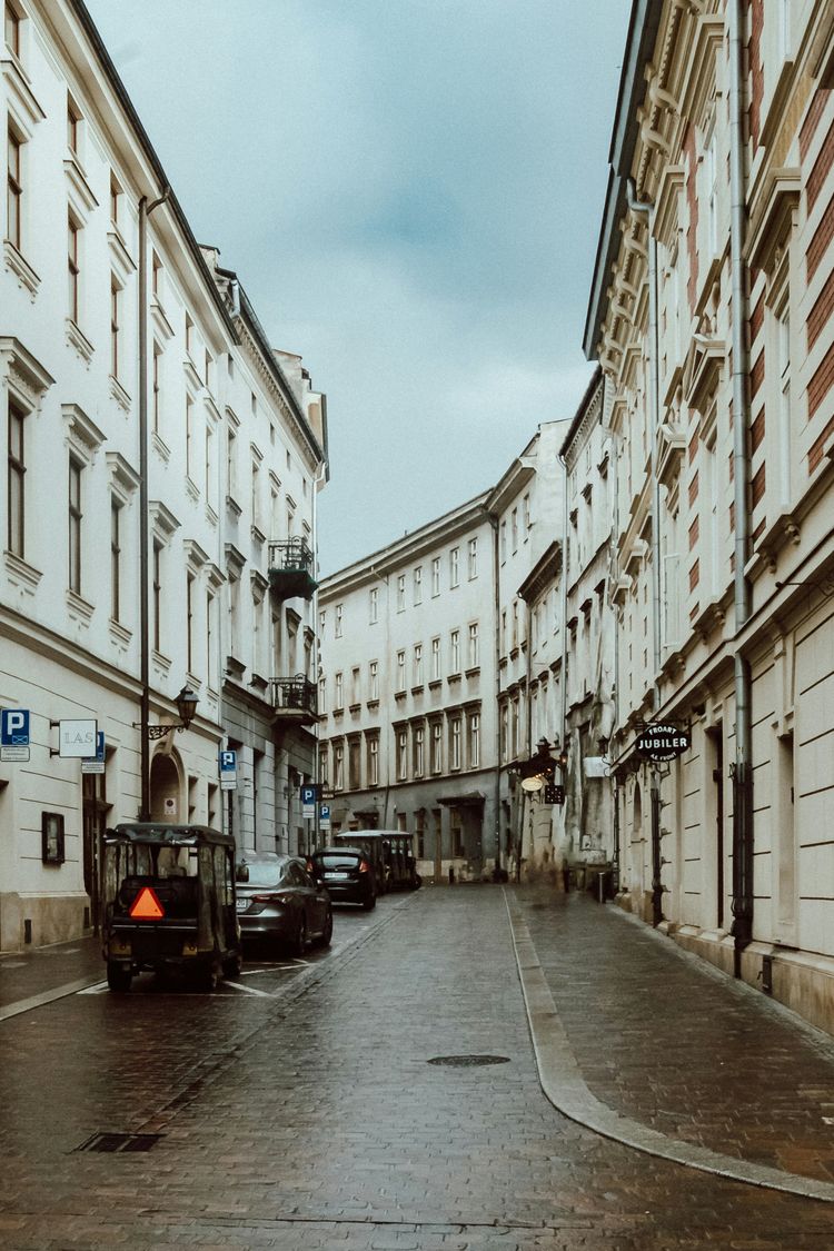 a street with cars parked on both sides of it