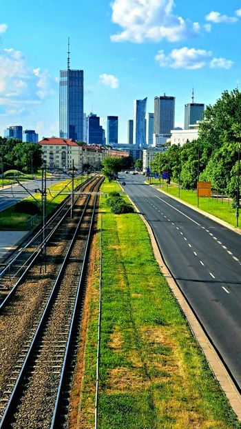 a view of a city from a train track