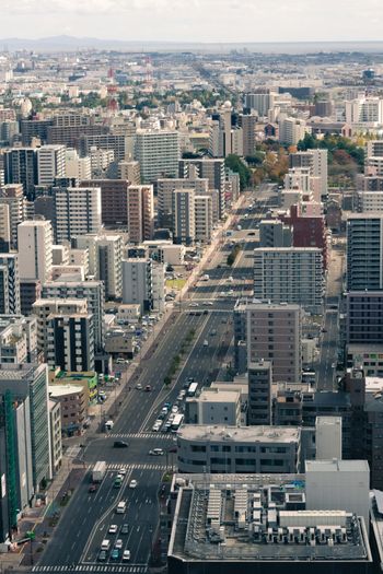 an aerial view of a city with tall buildings