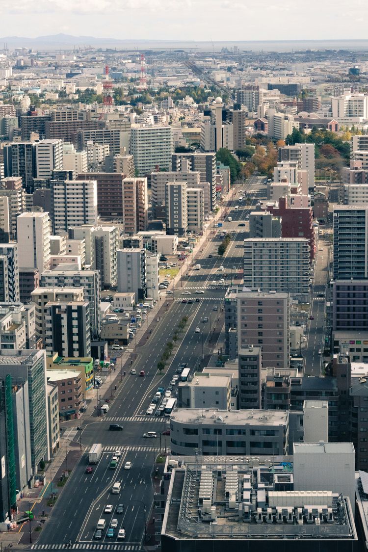 an aerial view of a city with tall buildings