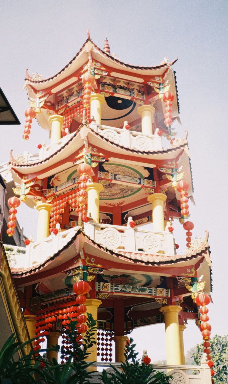 a tall tower with a clock on the top of it