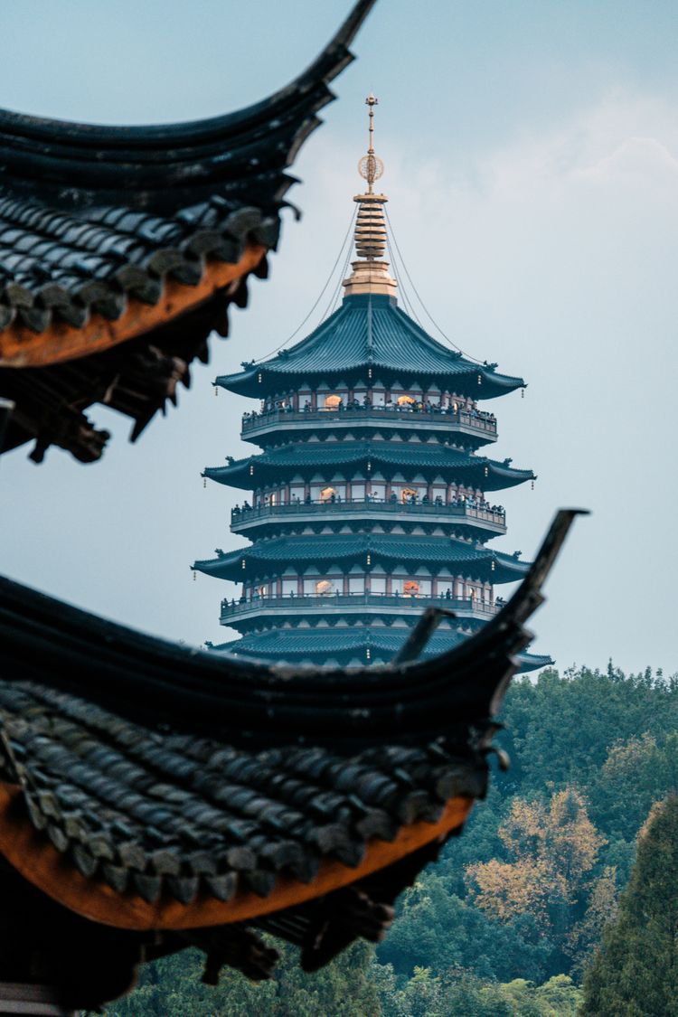 a tall building with a tower in the background