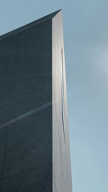 gray concrete wall under blue sky during daytime