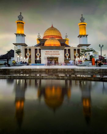 a large building with a yellow dome on top of it