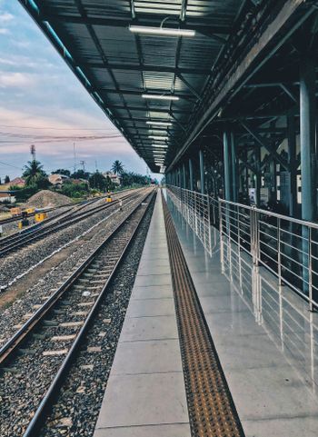 a train station with a train on the tracks