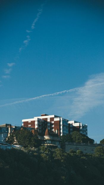 a building with a trail of smoke