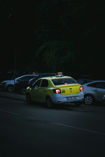 yellow and white police car on road during night time