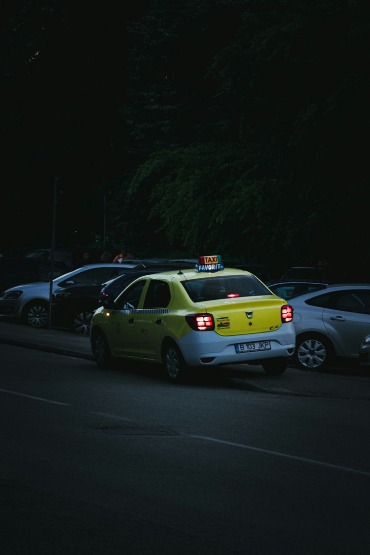 yellow and white police car on road during night time