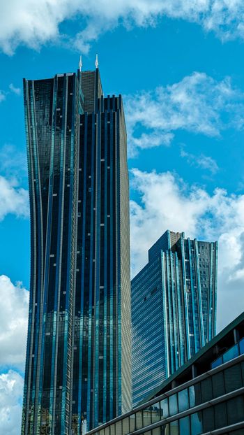 a very tall building sitting next to other tall buildings