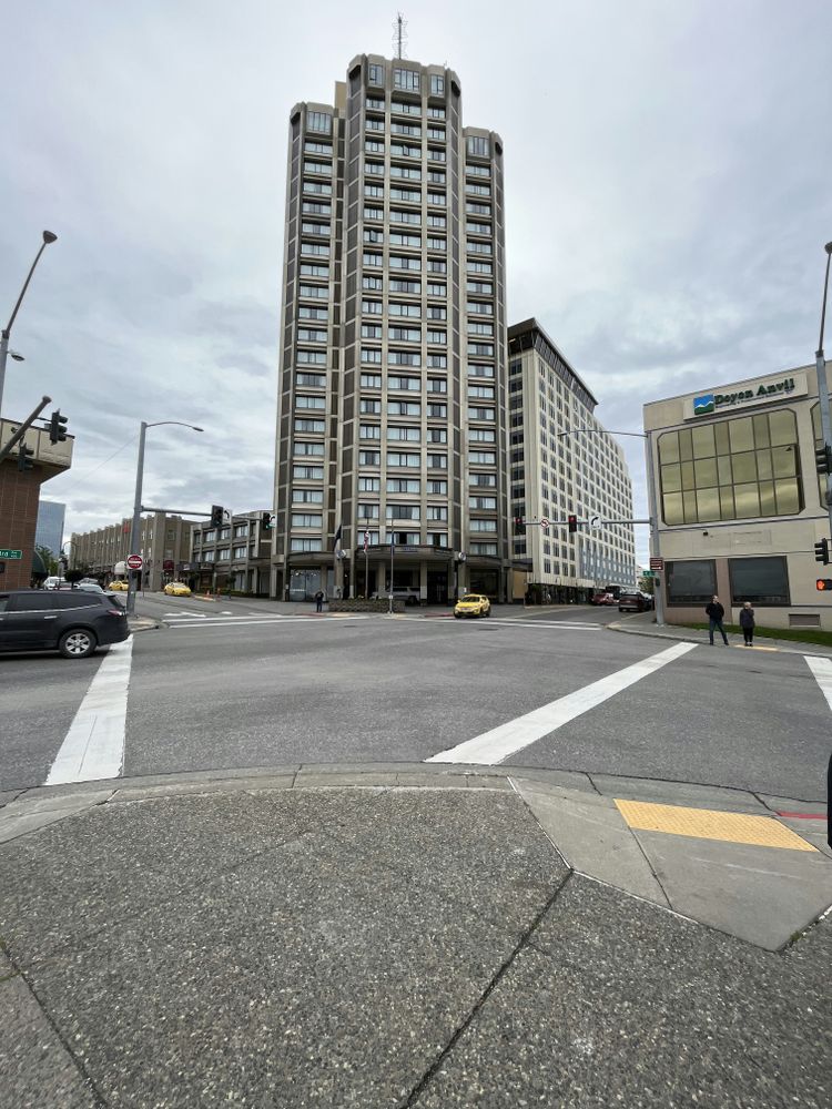 a tall building sitting on the corner of a street