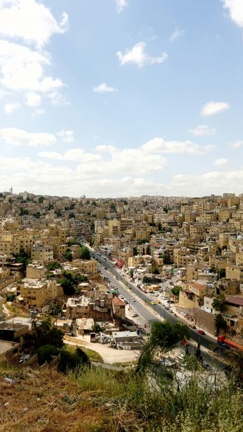 a view of a city from a hill