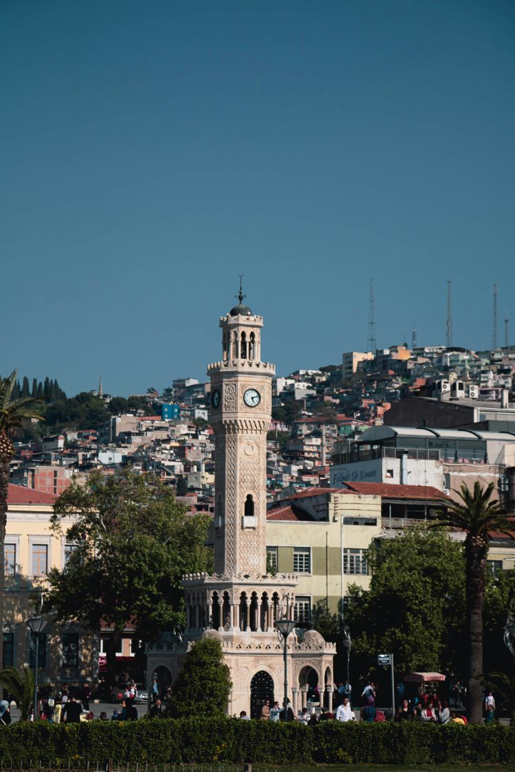 A tall clock tower towering over a city