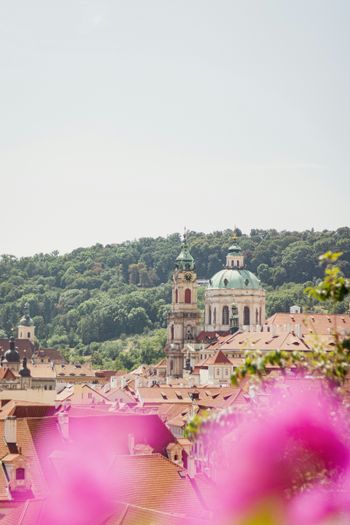 A view of a city with a clock tower in the background