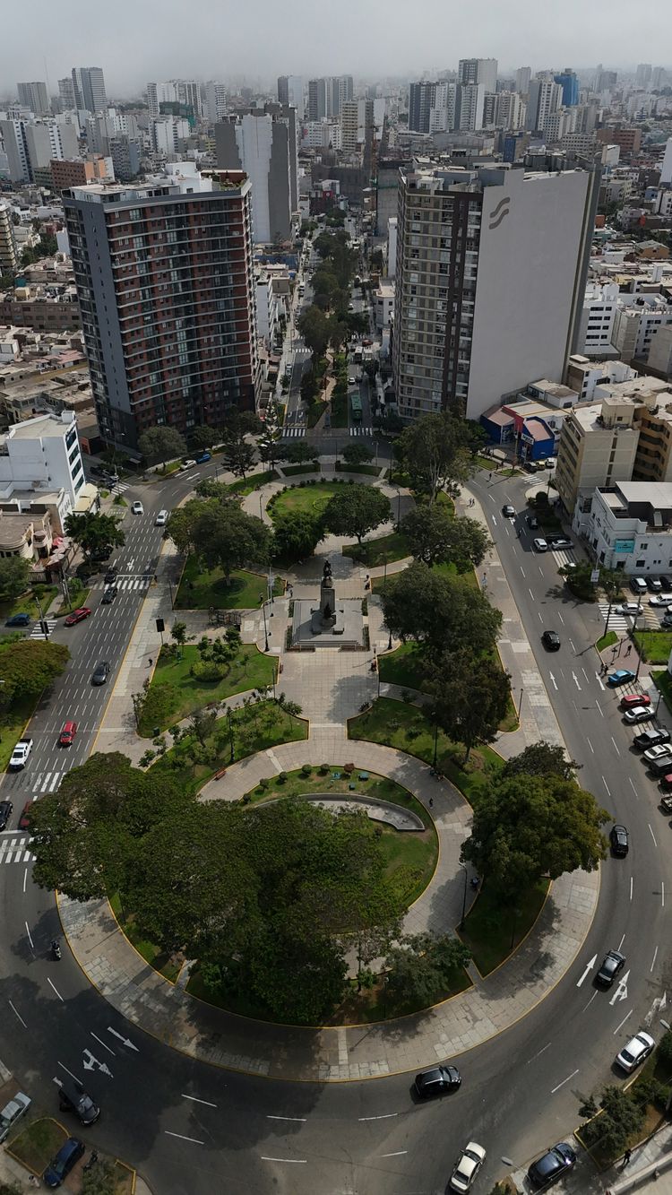 An aerial view of a city with tall buildings