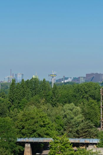 a view of a bridge over a river with a city in the background