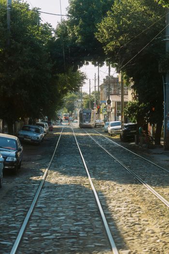 A street with cars parked on the side of it