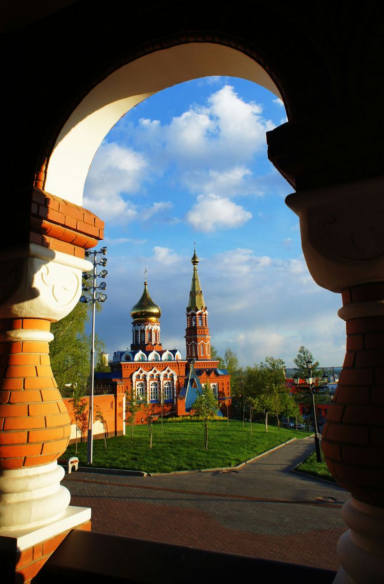 a view of a building through an arch