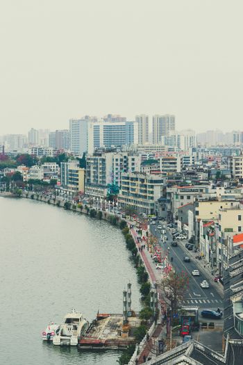 a large body of water surrounded by tall buildings