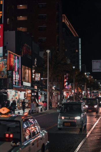 cars parked on side of the road during night time