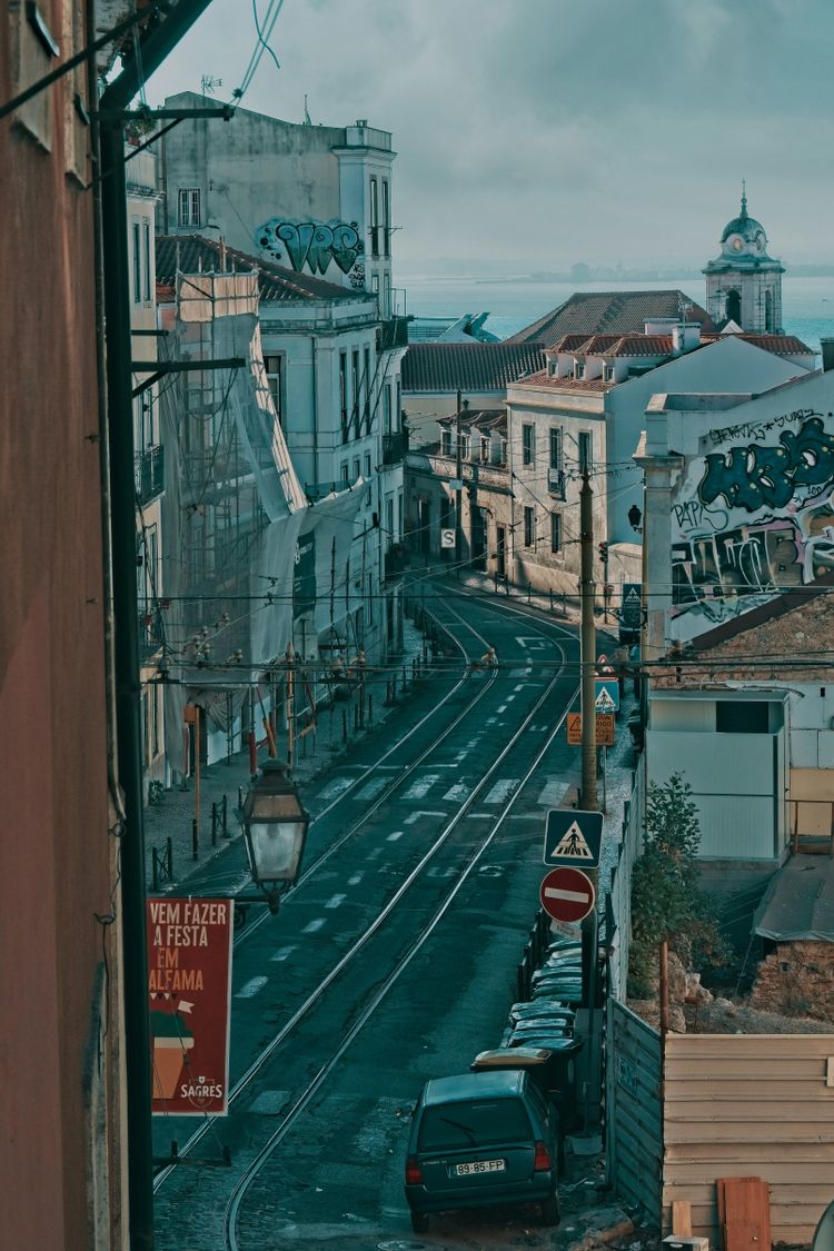 a street with cars and buildings