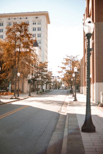 a street with a lamp post on the side of it