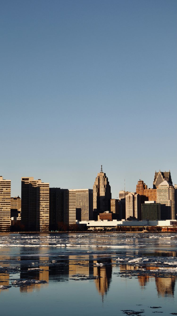 city skyline under blue sky during daytime