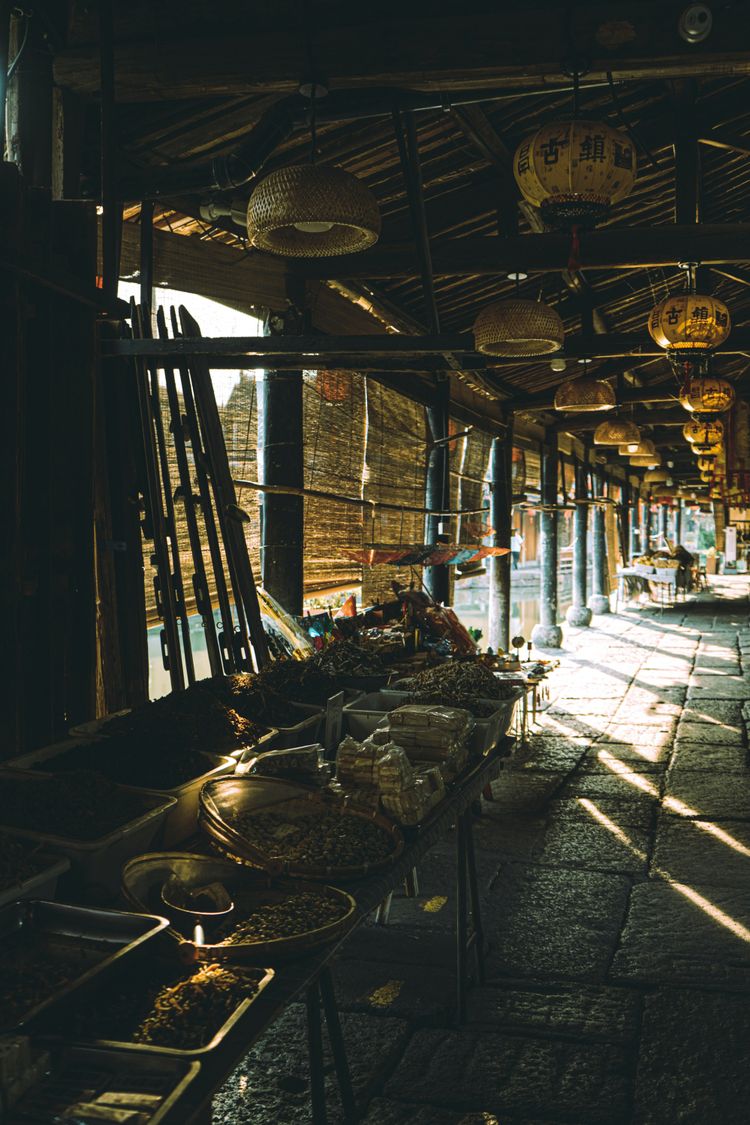 a long table with baskets of food on it