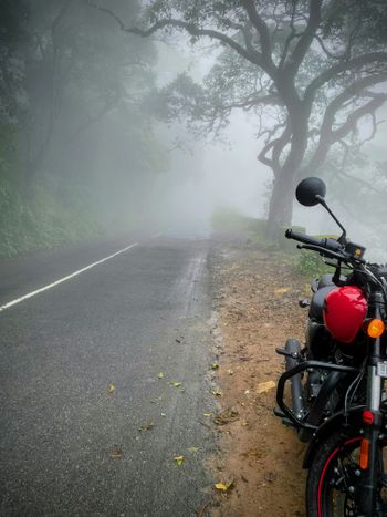a motorcycle parked on the side of a road