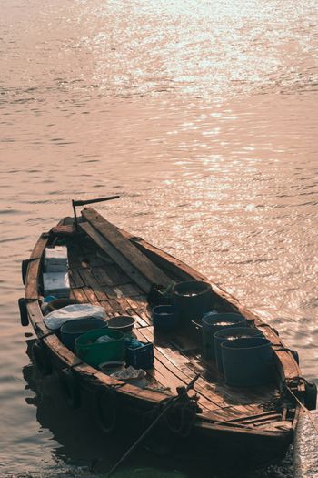 a small boat floating on top of a body of water