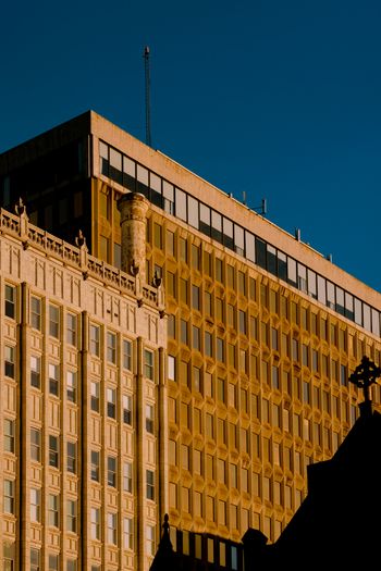 a tall building with a cross on top of it