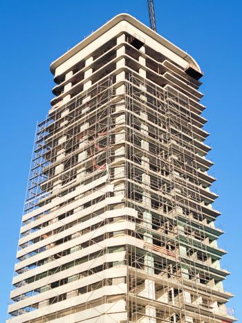 a tall building with scaffolding on the side of it